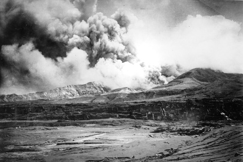 ST. PIERRE, MARTINIQUE - MAY 10: The city of St. Pierre lies in ruins after the eruption of the Mount Pelee volcano (in the background) in which 30,000 people were killed and only 2 survived 2 days after the eruption on May 10, 1902 at St. Pierre, Martinique. (Photo by Archive Farms/Getty Images)